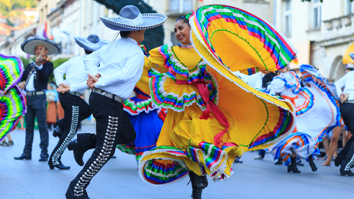 Mexican dancers and a mariachi band perform
