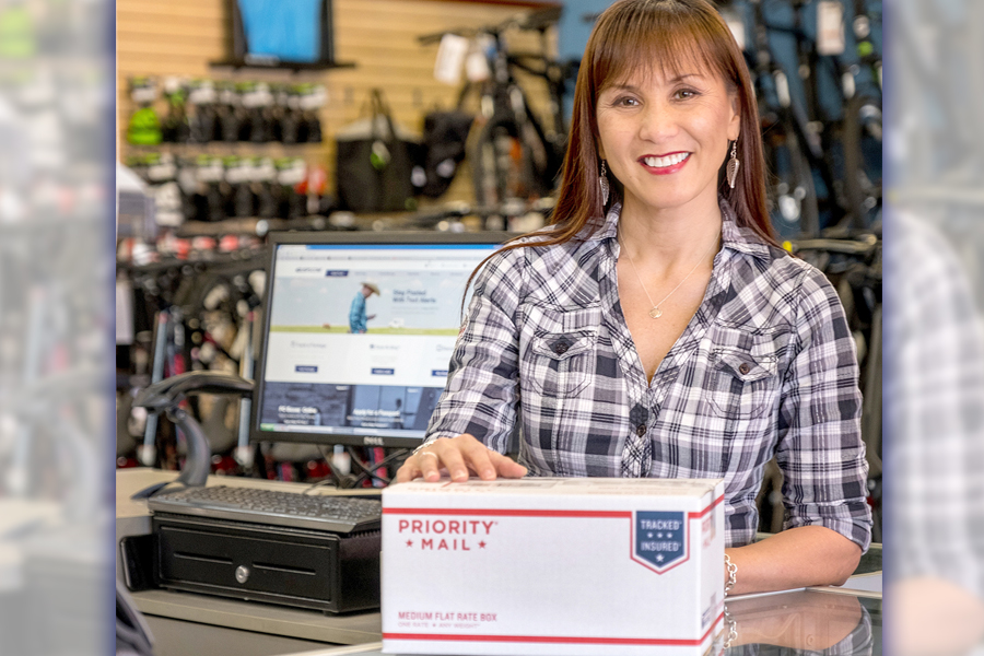 Woman with Priority Mail package
