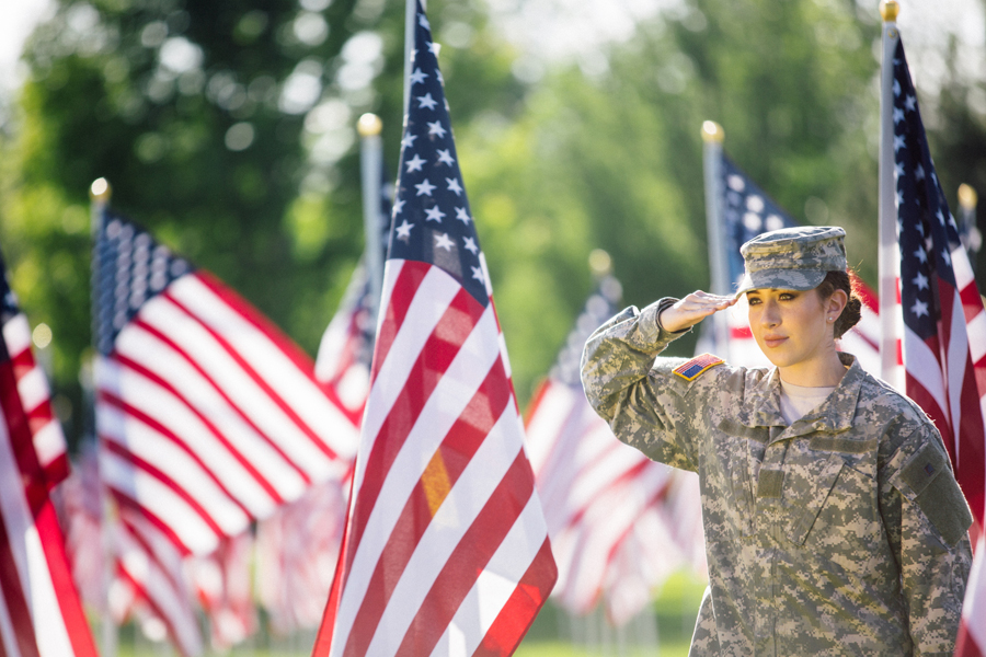 Soldier saluting a flag