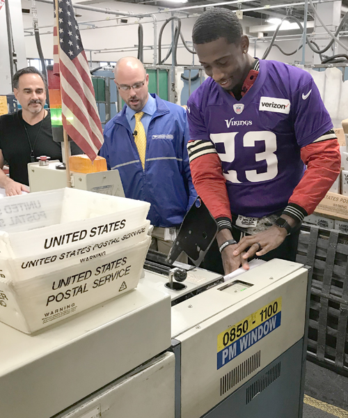 Minnesota Vikings football player visits Postal Service processing center