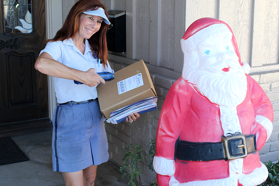Letter Carrier Nina Monreal scanning a package