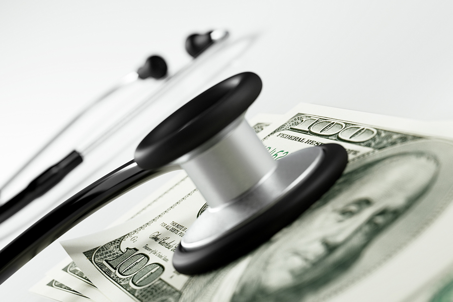 Stethoscope with a hundred-dollar bill