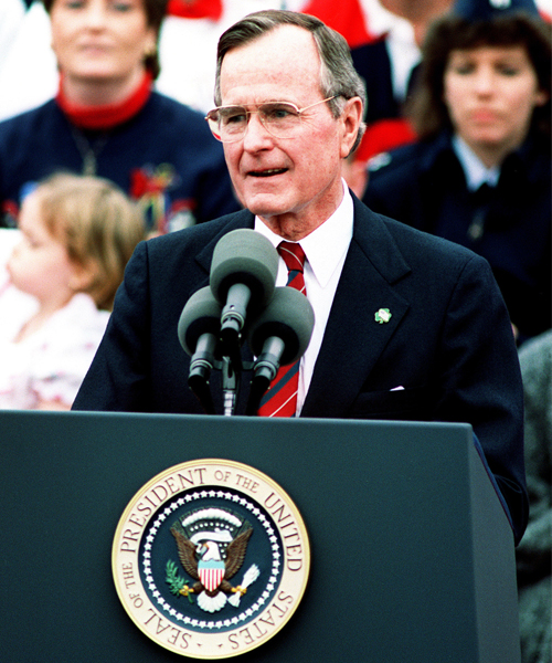 President George H.W. Bush speaks at podium