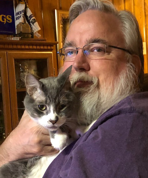 Mark Janda and his cat Buzz