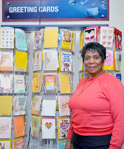 Chicago Mail Handler Bessie Flemons stands near greeting cards