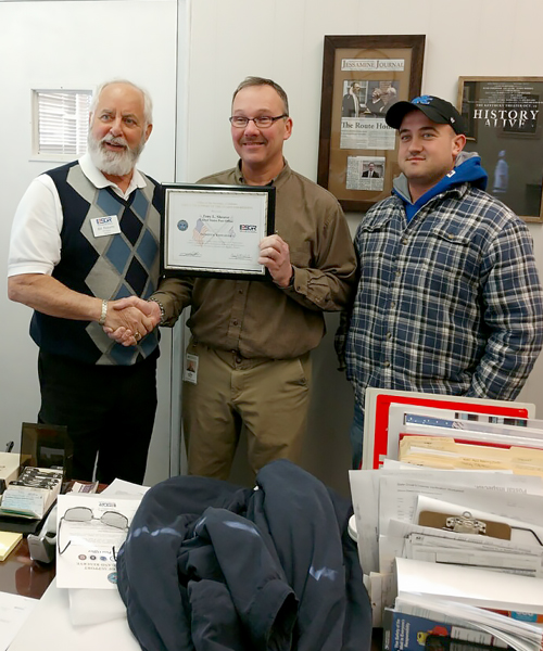 Employees pose with Patriot Award