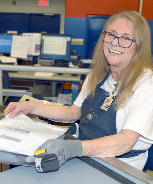 Donna Dyches, a mail processing clerk at the Columbia, SC, Processing and Distribution Center, strives to deliver accurate, timely scans.