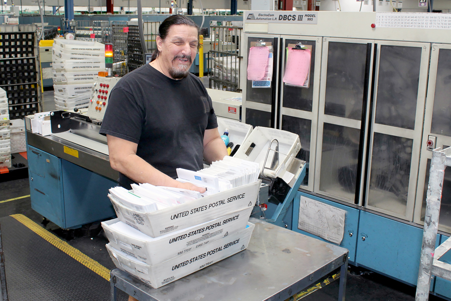 Postal employee works at plant.