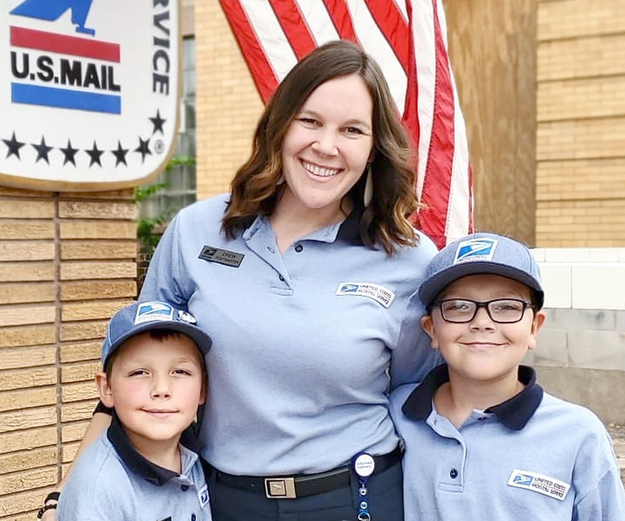 Postal employee and her two young sons.