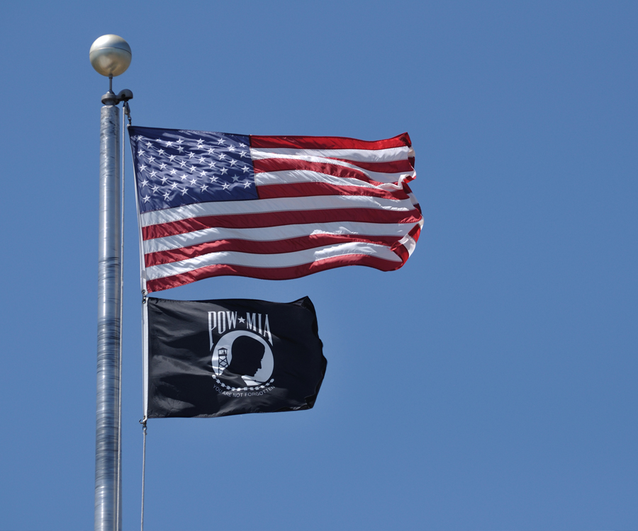 U.S. flag flying above POW-MIA flag