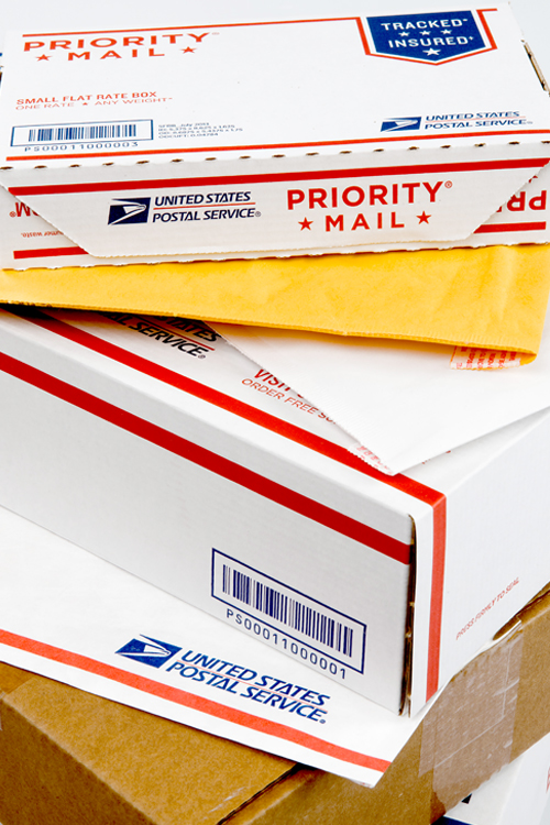Stack of USPS-branded package boxes