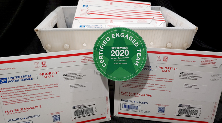 USPS seal sits among postal shipping boxes