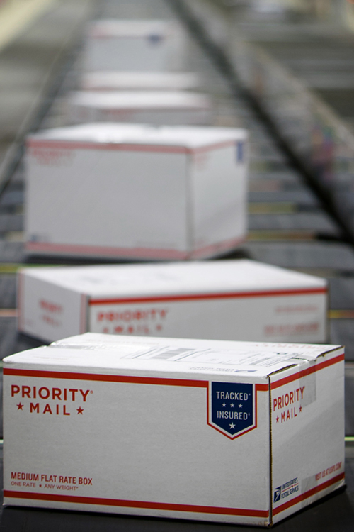 Priority Mail packages on coveyor belt