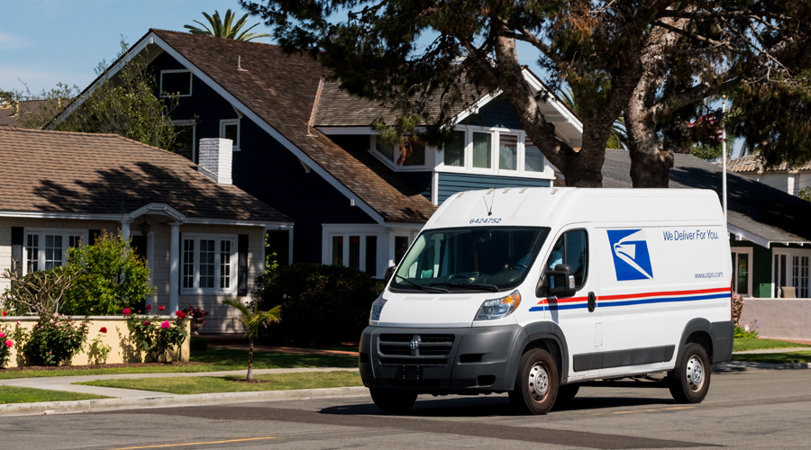 USPS delivery vehicle on residential street