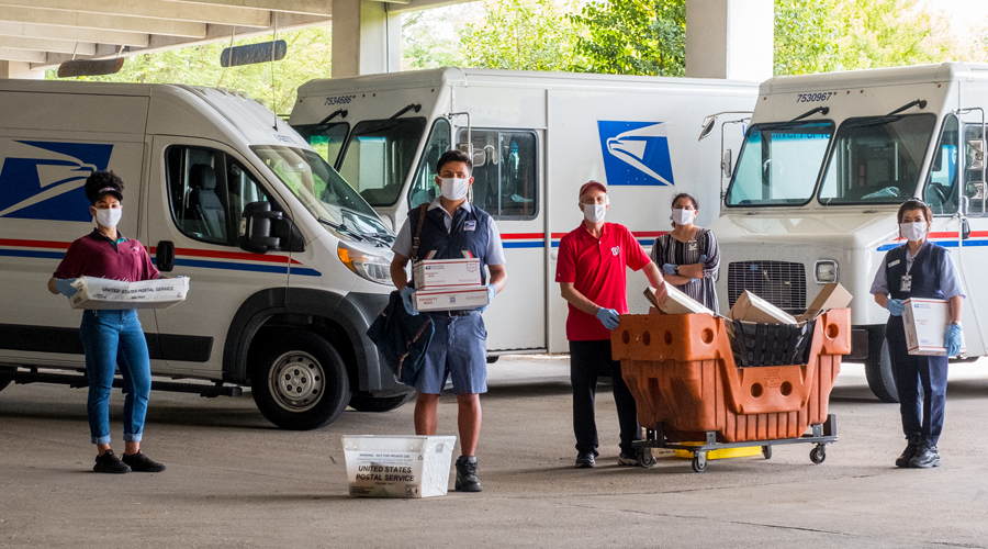 Postal workers wearing face masks